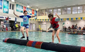 two kids logrolling